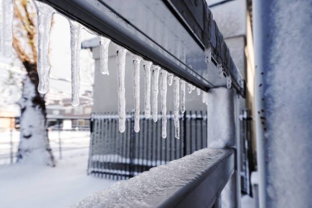 istock Icicle is hanging from a roof 1071362328