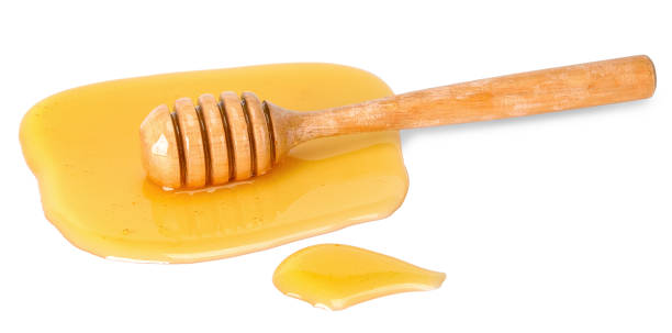 istock Honey isolated on white with clipping path 1071363246