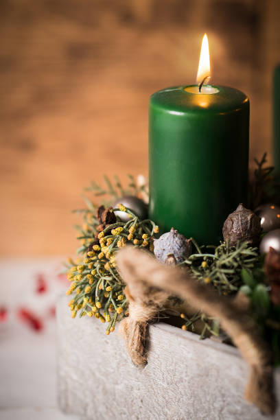 istock modern Advent arrangement with lit candles 1071364854