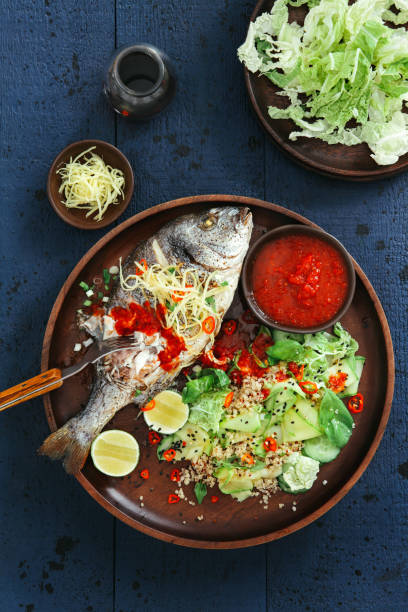 istock Grilled sea bream with zucchini, herbs, ginger and quinoa salad 1071365006