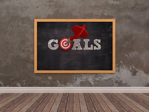 Chalkboard with GOALS Word with Target and Dart - 3D Rendering