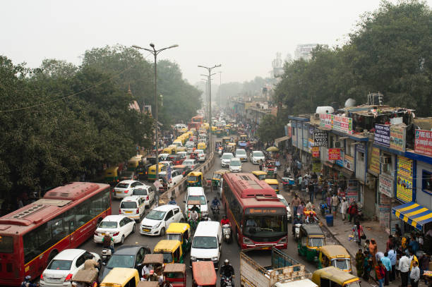 Traffic jam on the polluted streets of New Delhi, India. Traffic jam on the polluted streets of New Delhi, India. Delhi has the highest number of motor vehicles and the traffic congestion is limited in few areas. auto rickshaw taxi india stock pictures, royalty-free photos & images
