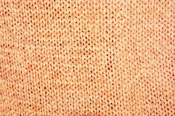 istock Beige background of knitted fabric 1071373514