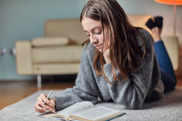 istock Seventeen year old teenager doing her homework 1071375662