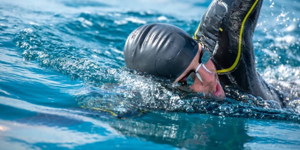 istock Open water swimmer swimming in sea 1071375716