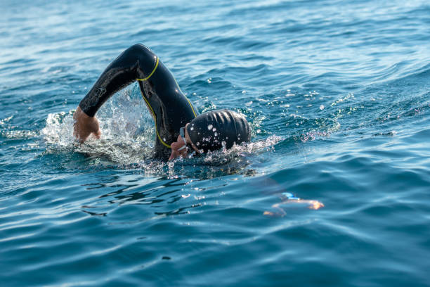 istock Open water swimmer swimming in sea 1071375726