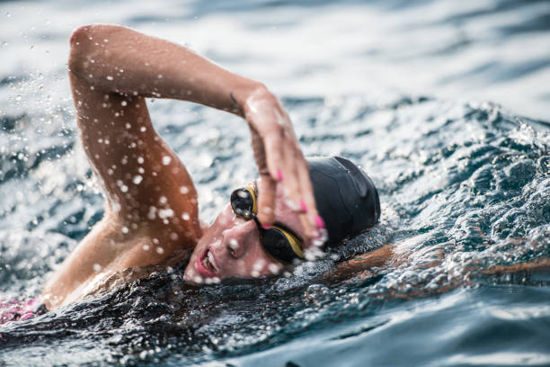 istock Open water swimmer swimming in sea 1071375732