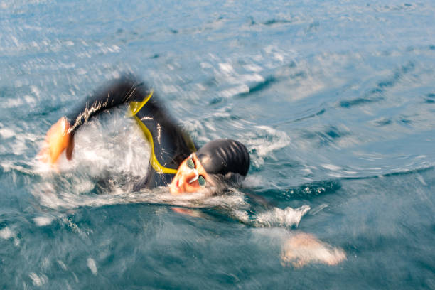 istock Open water swimmer swimming in sea 1071375734