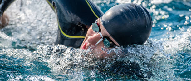 istock Open water swimmer swimming in sea 1071375736