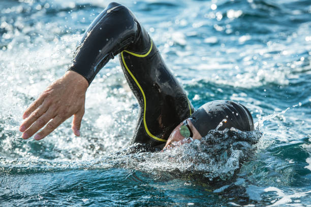 istock Open water swimmer swimming in sea 1071375740