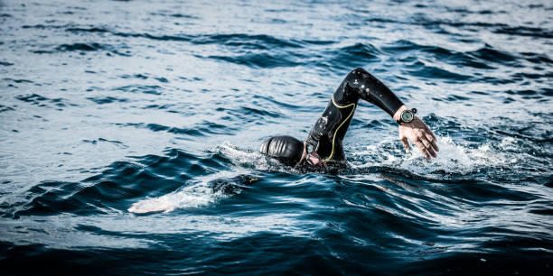 istock Open water swimmer swimming in sea 1071375742