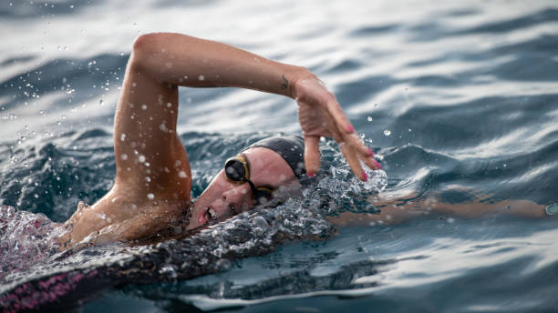 istock Open water swimmer swimming in sea 1071375770