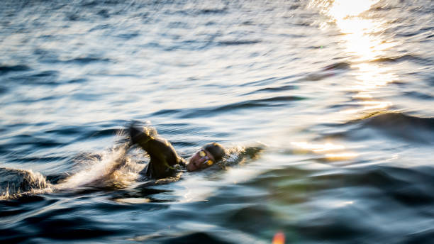 istock Open water swimmer swimming in sea 1071375820