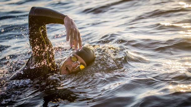istock Open water swimmer swimming in sea 1071375830