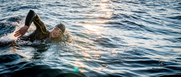 istock Open water swimmer swimming in sea 1071375838