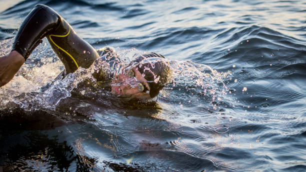 istock Open water swimmer swimming in sea 1071375842
