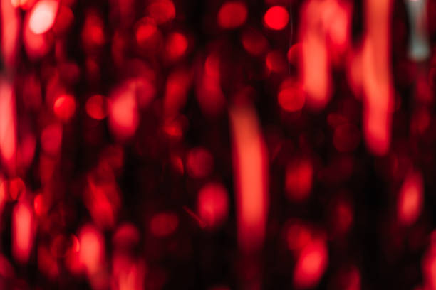 istock dark red blurred streamers as christmas background 1071377884