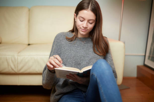 istock Seventeen year old teenager doing her homework 1071378232