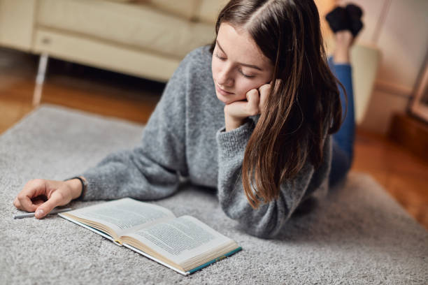 istock Seventeen year old teenager doing her homework 1071378282