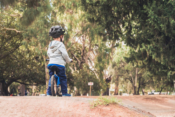 istock Kid riding balance bike 1071378426