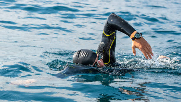 istock Open water swimmer swimming in sea 1071378432