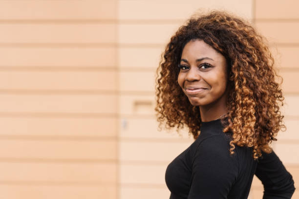 istock Cute pleased young African woman 1071380892