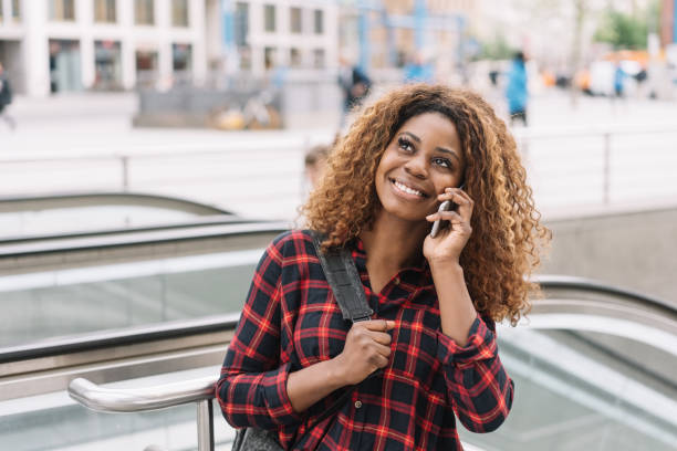 istock Happy relaxed young woman chatting on her mobile 1071381416