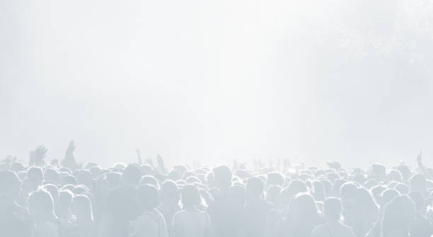 istock Crowd of spectators at a concert in light blue tonality 1071382634