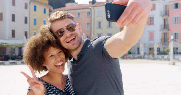 istock Friends taking selfie with smart phone 1071383008