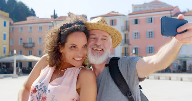 istock Couple taking selfie with smart phone 1071383016