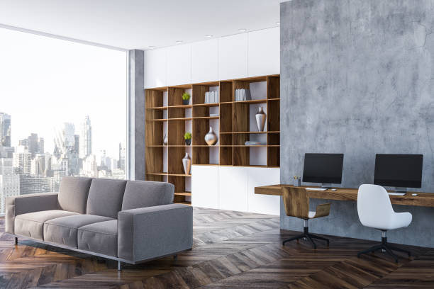 istock Gray home office corner, bookcase and sofa 1071383206