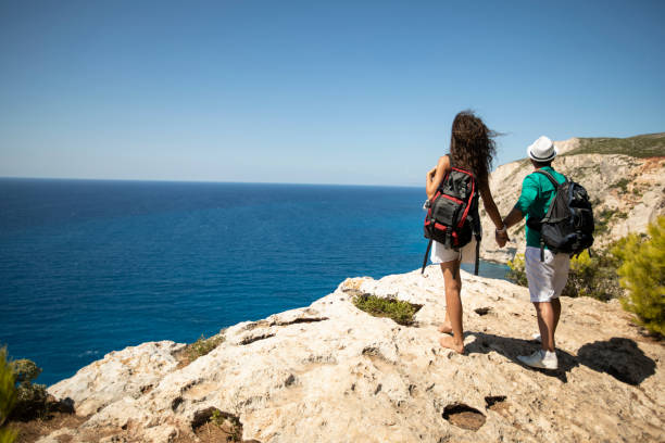 istock Couple backpackers standing on top 1071385634