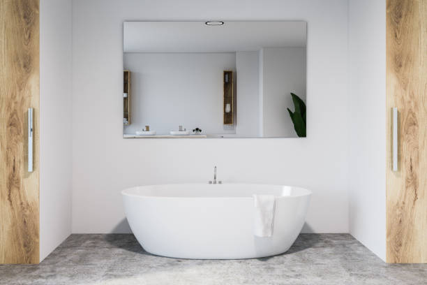 istock White and wooden bathroom interior, tub and mirror 1071386322