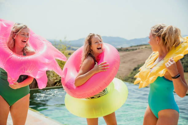istock Mature Friends Laughing by the Pool 1071388418