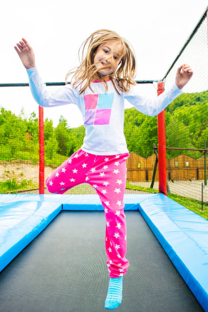 istock Trampoline Girl Jump 1071388710