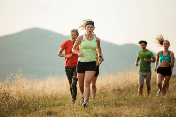 istock Woman Running Through the Tuscan Fields 1071390842