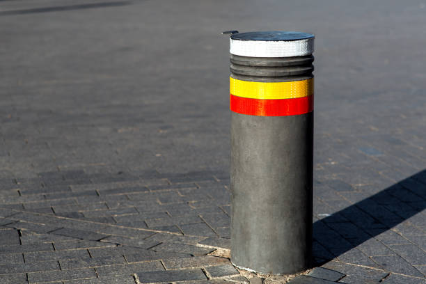 istock Retractable bollards on paving slabs. 1071391746