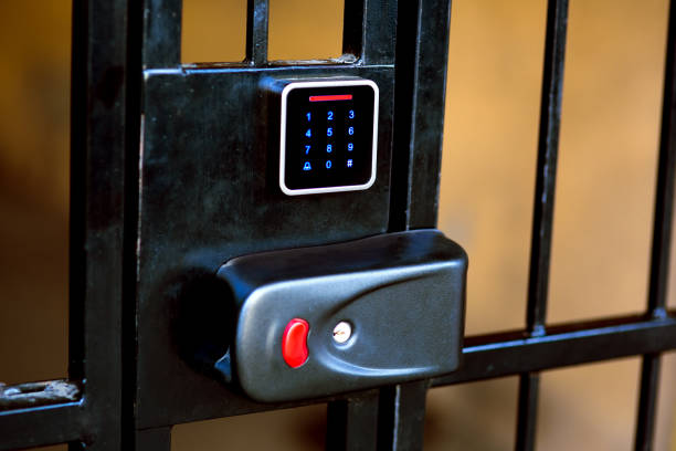istock The lock on the iron gate with a hole for the key. 1071392992