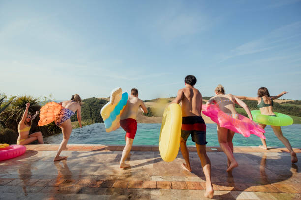 istock Friends about to Jump into the Pool 1071393156