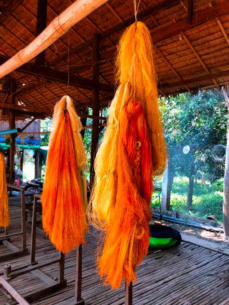 istock Cambodia, Silk Island, Orange raw silk thread 1071395398