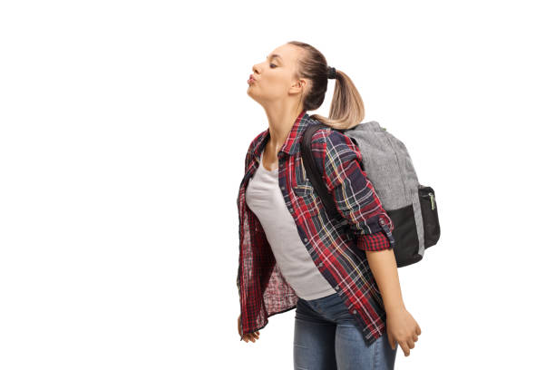 istock Student girl blowing a kiss 1071396026