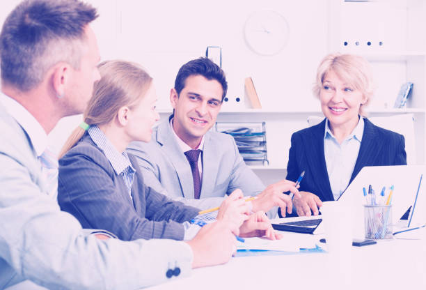 istock Business partners discussing projects in office 1071398490
