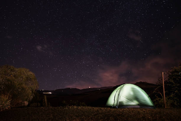 Camping under the Stars Relaxing under the stars in the tent. space milky way star night stock pictures, royalty-free photos & images