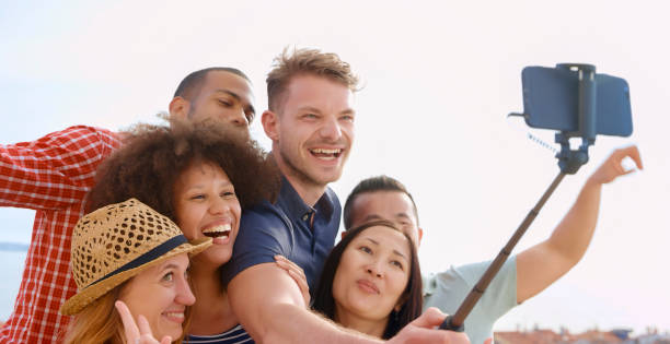 istock Friends taking selfie with smart phone 1071399364