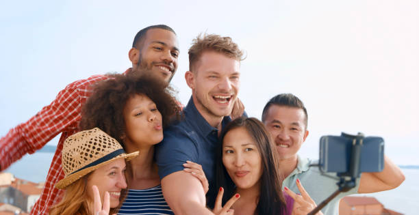 istock Friends taking selfie with smart phone 1071399366