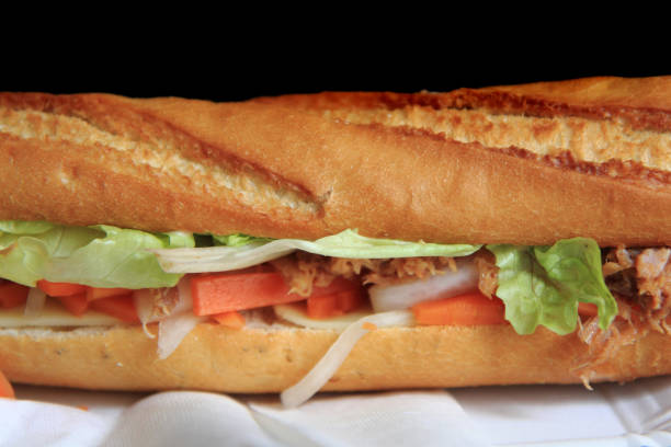 istock baguette on the black background 1071402204