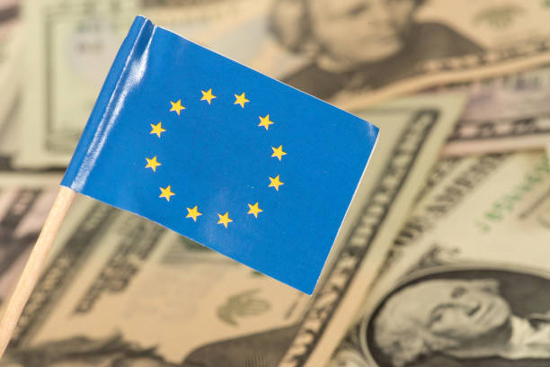 flag of the european union eu and dollar banknotes in the background - currency exchange currency european union currency dollar imagens e fotografias de stock