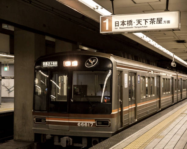Osaka, Japan  - October 18, 2018: An Osaka Subway train bound for Tengachaya in the subway station at Osaka, Japan.