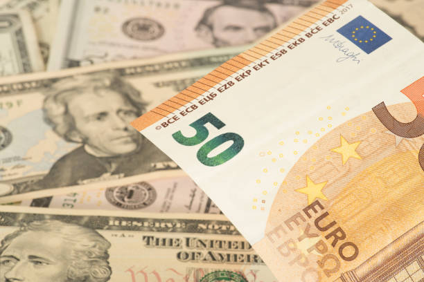 istock Euro banknotes and dollar banknotes in the background 1071406842