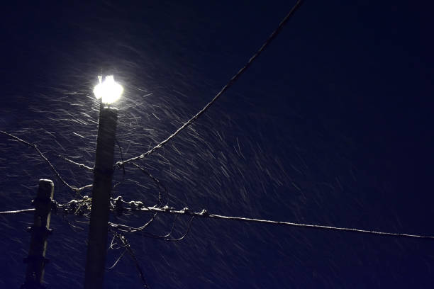 istock Winter street lamp during a snowfall. 1071408718